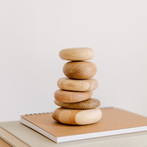 Stock of round polished rocks with beige books