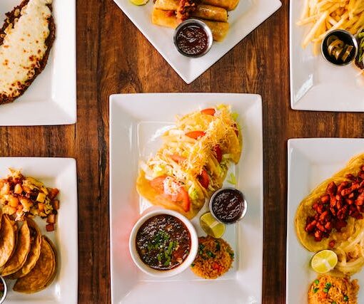 Tacos with dipping sauce with white ceramic plate