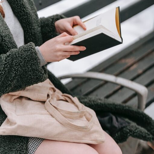 Reading a book outside a winter weather